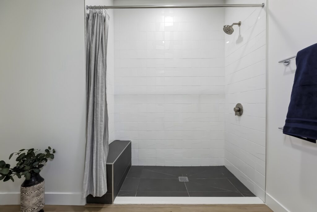 walk-in shower with sitting bench