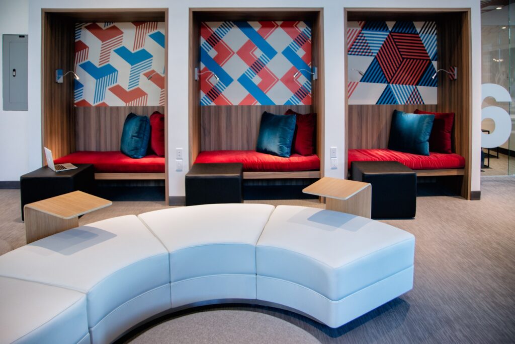 Interior clubhouse with lounge seating, designer lighting, and carpet flooring