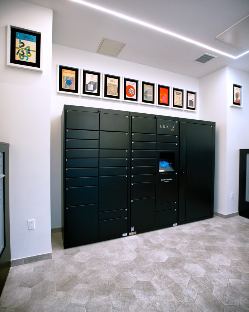 Interior clubhouse mail room with tile flooring and Luxer One lockers