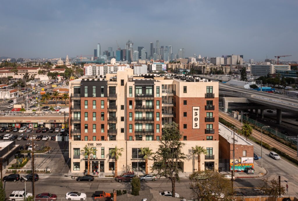 Aerial view of the apartment complex surrounded by buildings