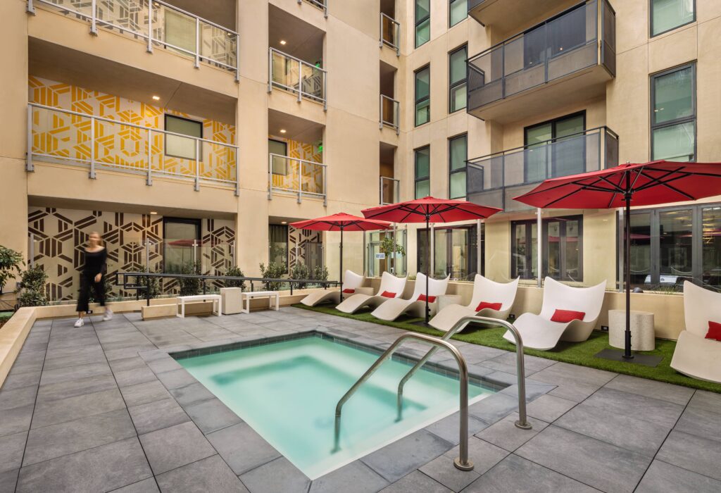 Outdoor swimming pool with shaded seating